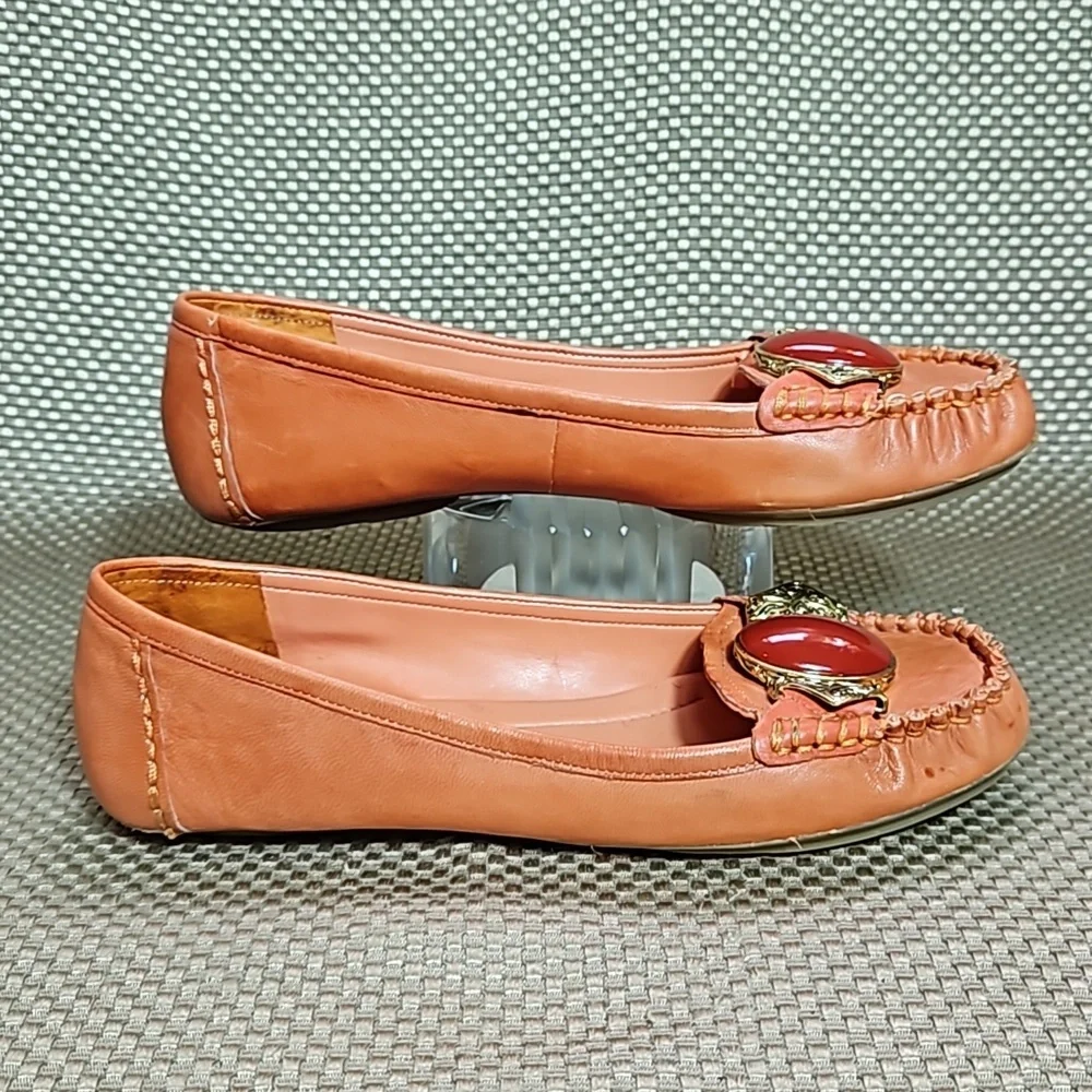 BCBG Leather Loafers.  Gold Embellishment with Coral Colored Jewel.  Size 6.5 B